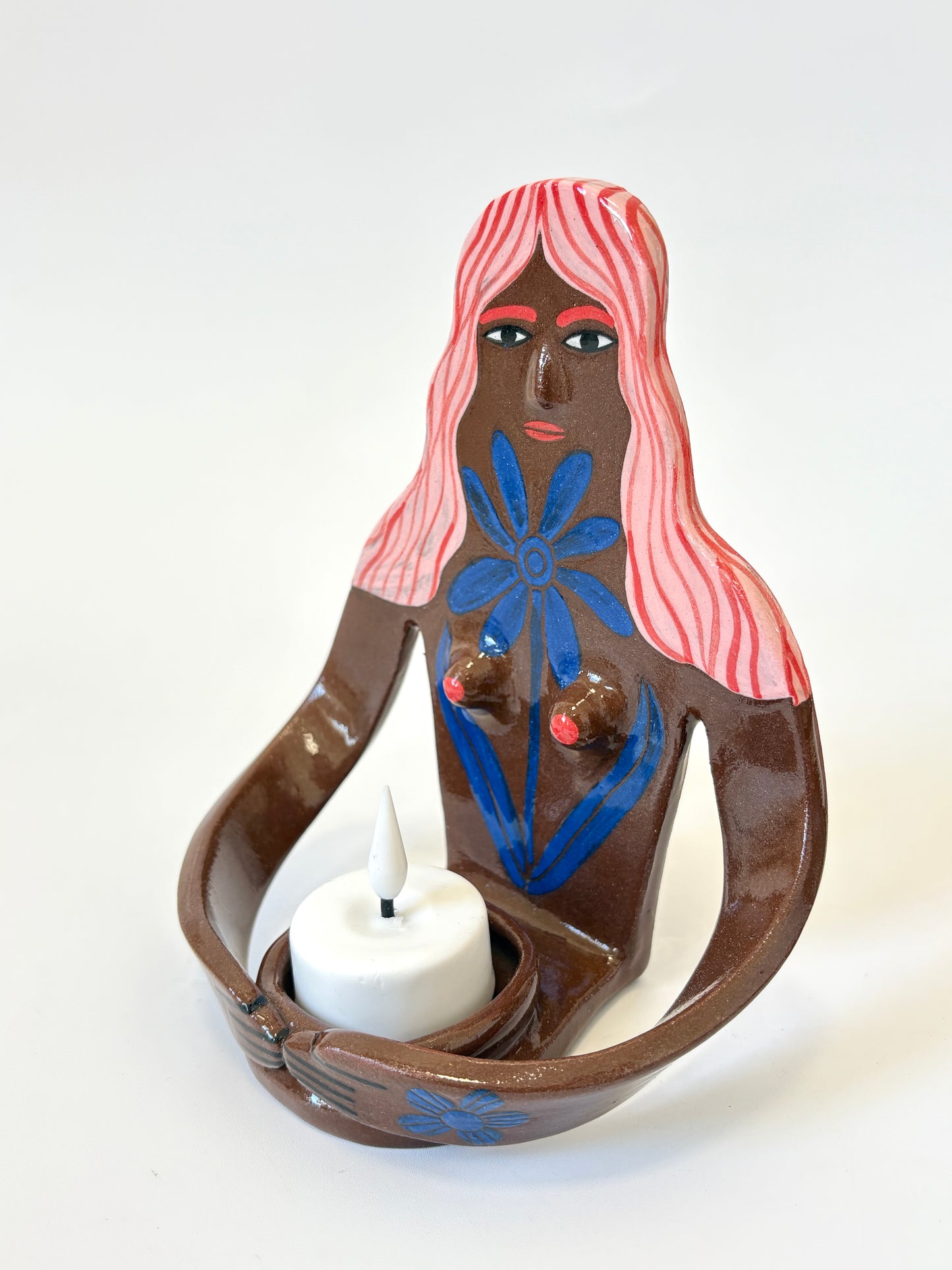 Pink Hair Girl with blue flower, brown skin - Full Body Candle Person - Ceramic candle holder by Studio Soph