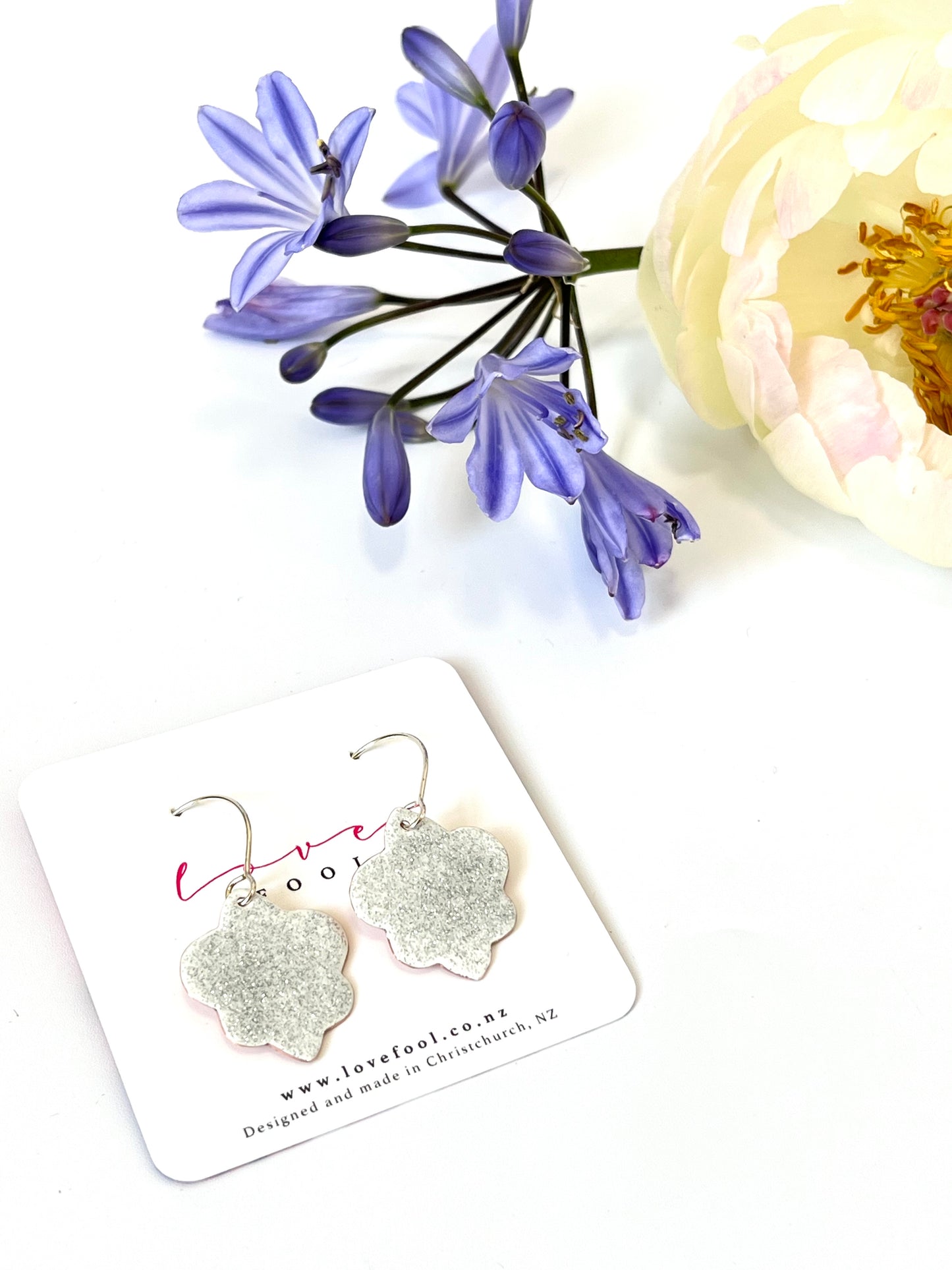 Fleur de Lis Earrings - White, Silver Glitter