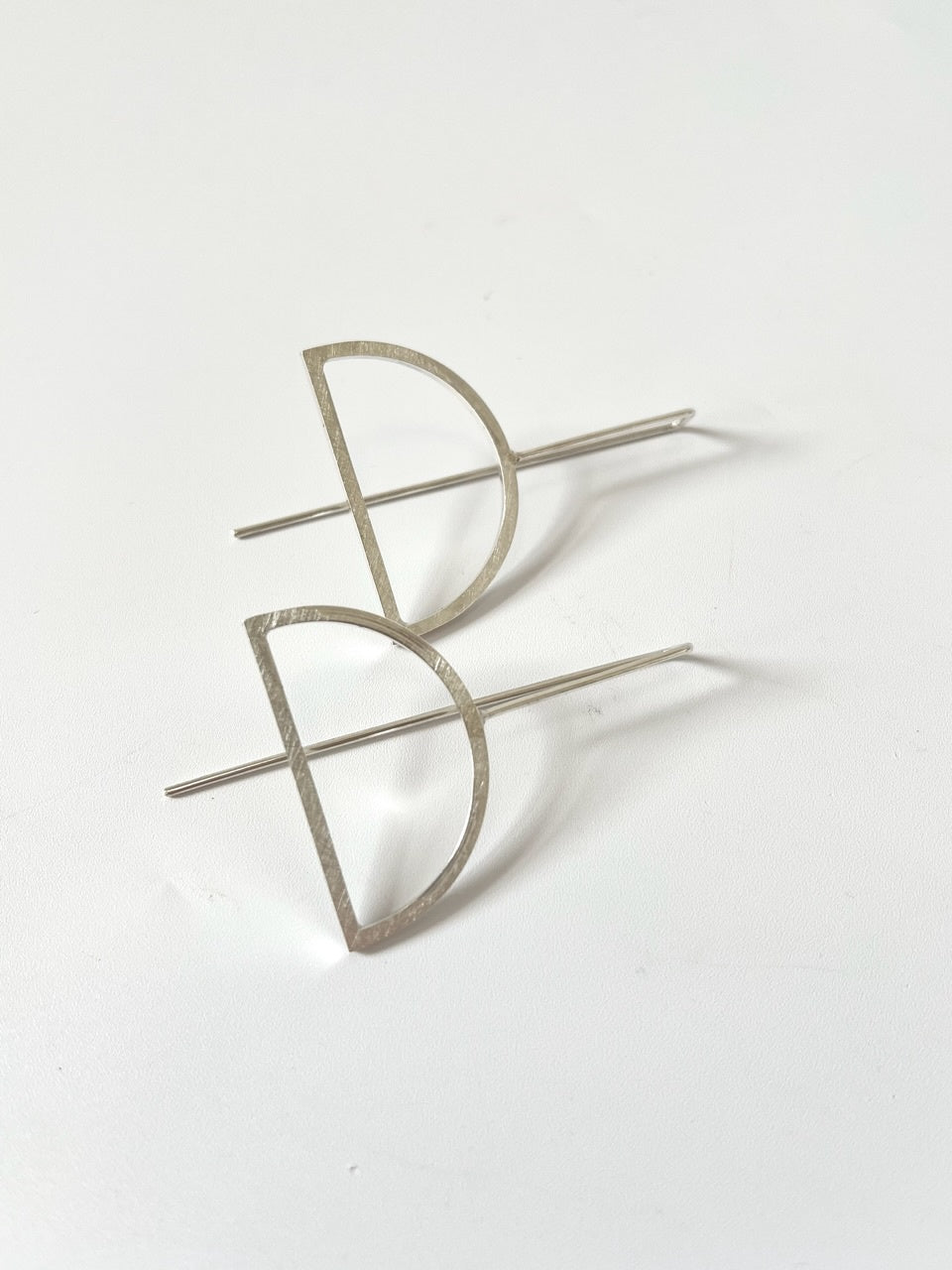 Silver Arch Earrings on Bar