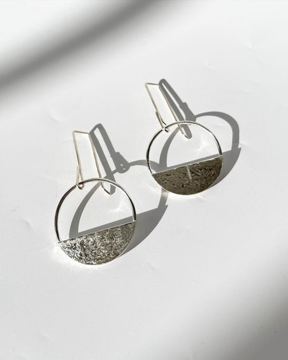 Silver hoop earrings with solid piece