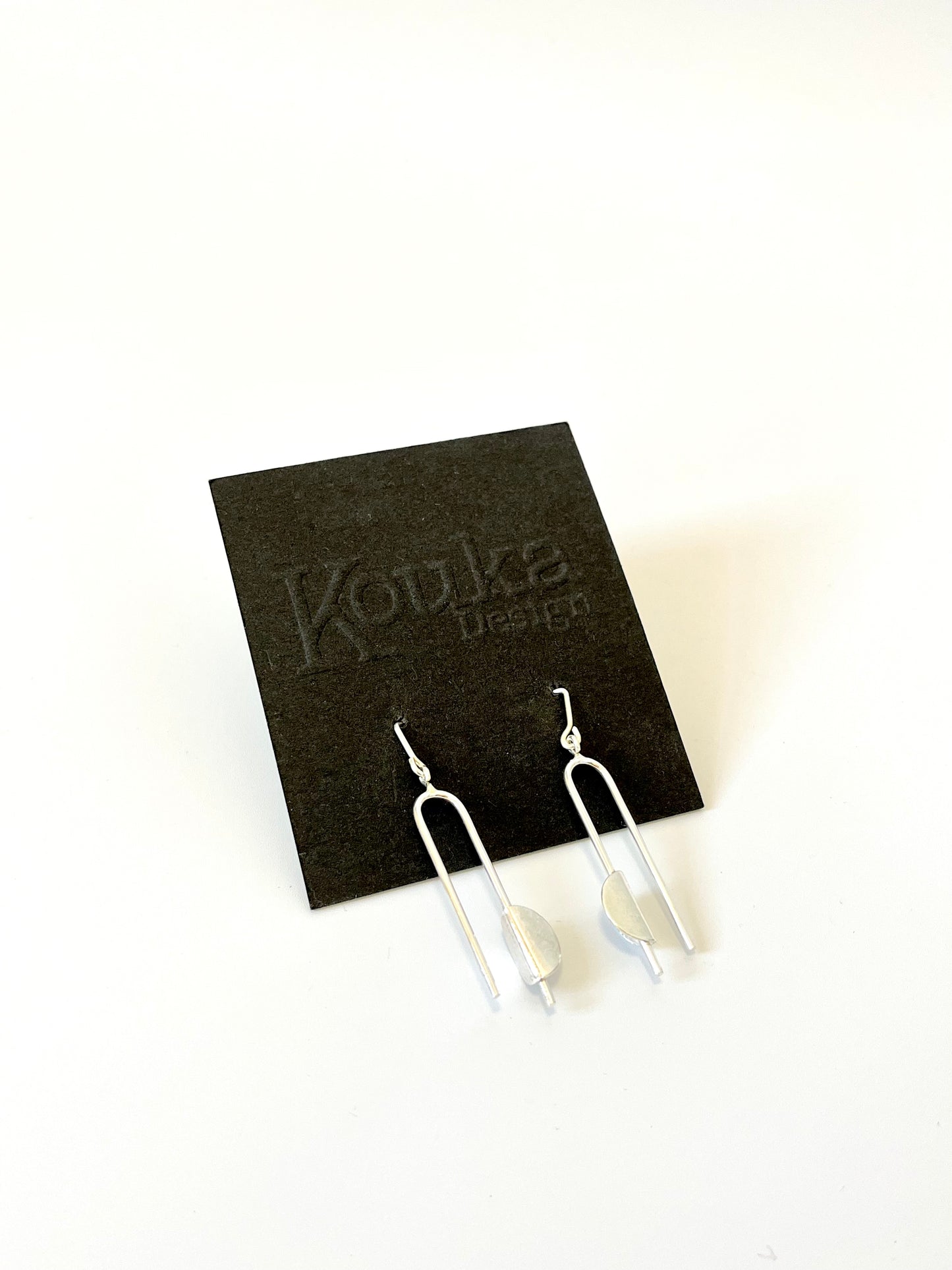 Silver N-Shape Earrings with Bent Disc